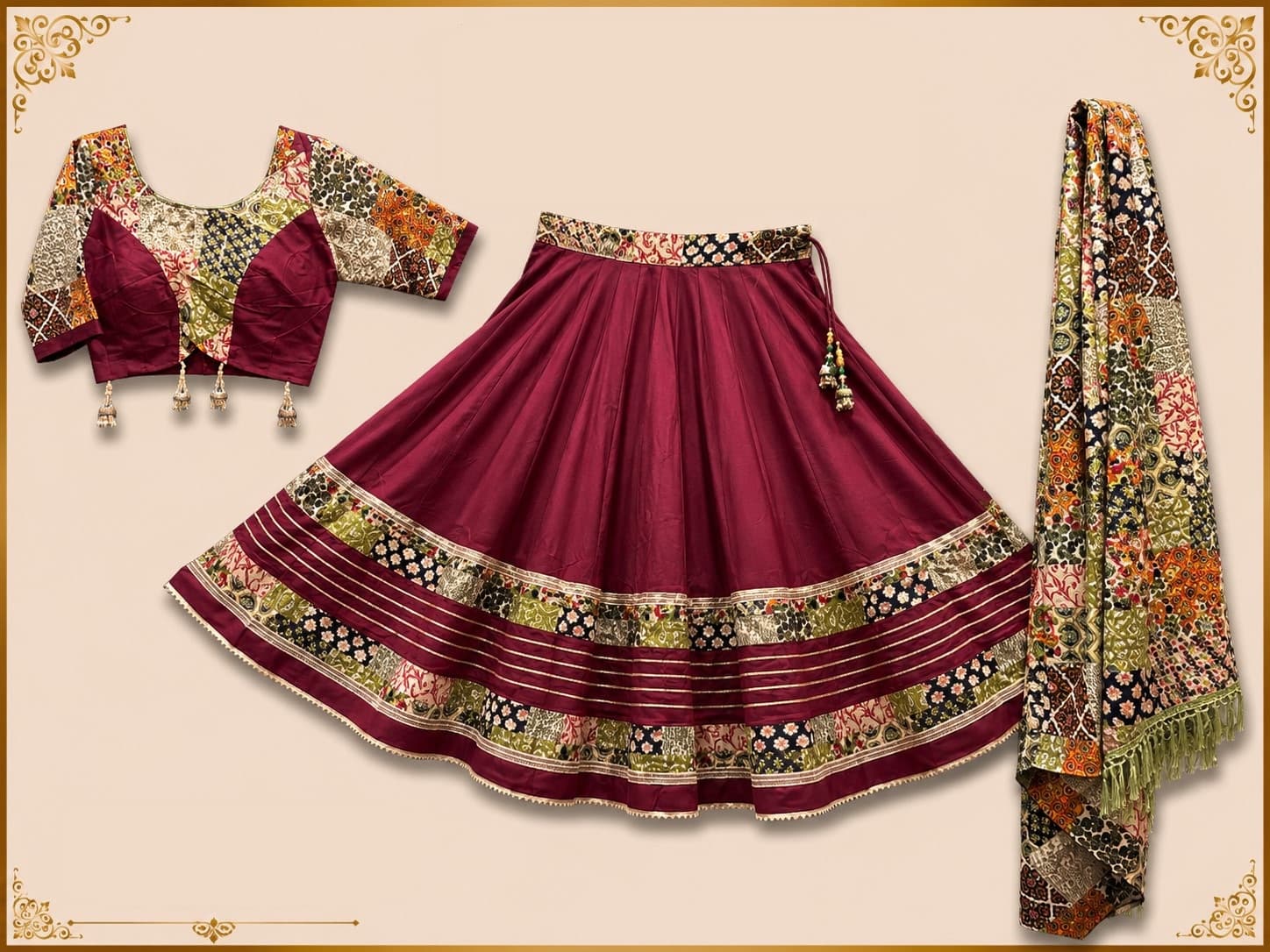 Maroon pleated skirt with patchwork-print bands and gota stripes, patchwork blouse with ghungroo tassels and a fringed patchwork dupatta