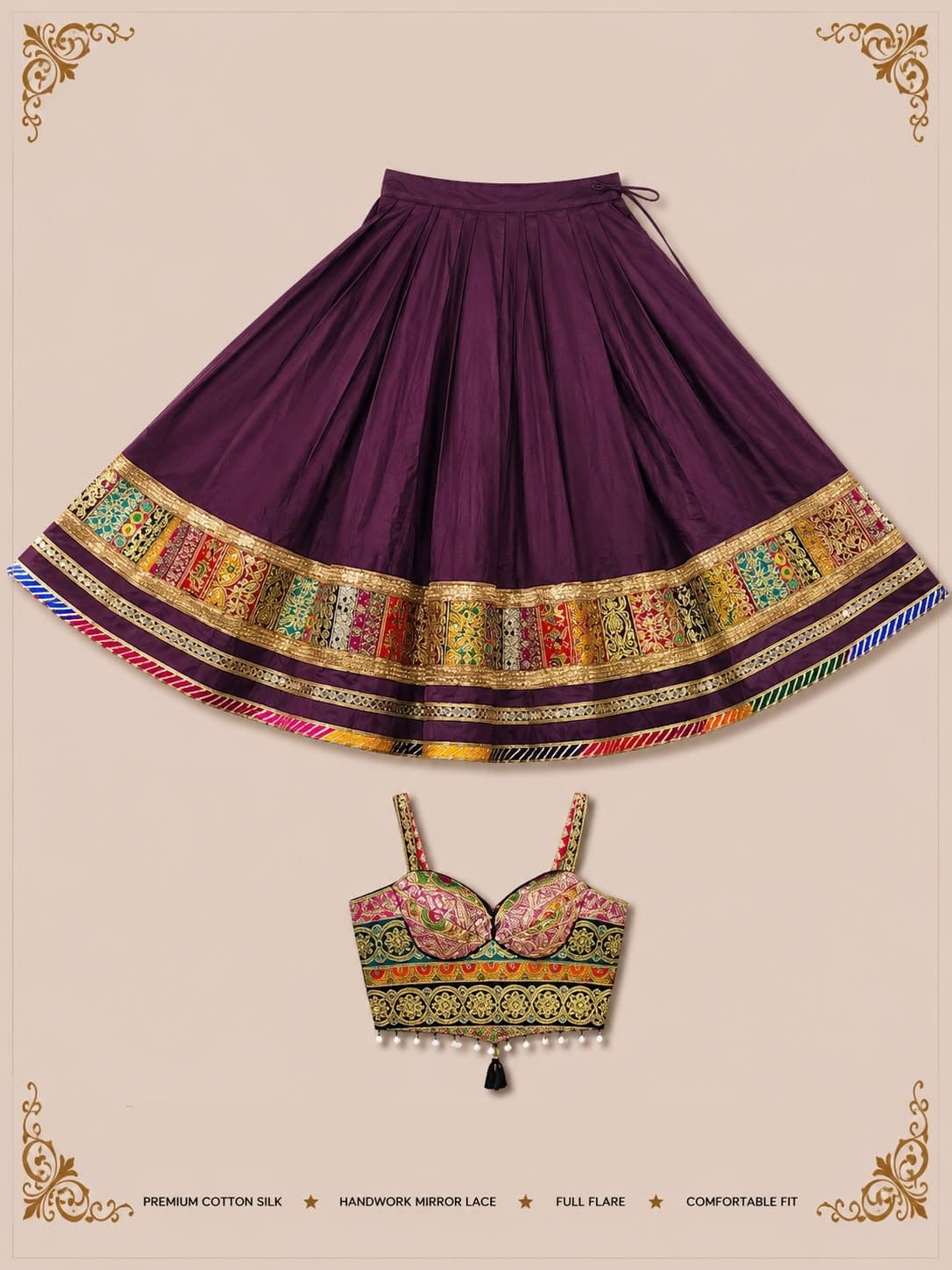 Plum pleated skirt with a broad multicolour brocade border and a strappy brocade blouse with pearl drops